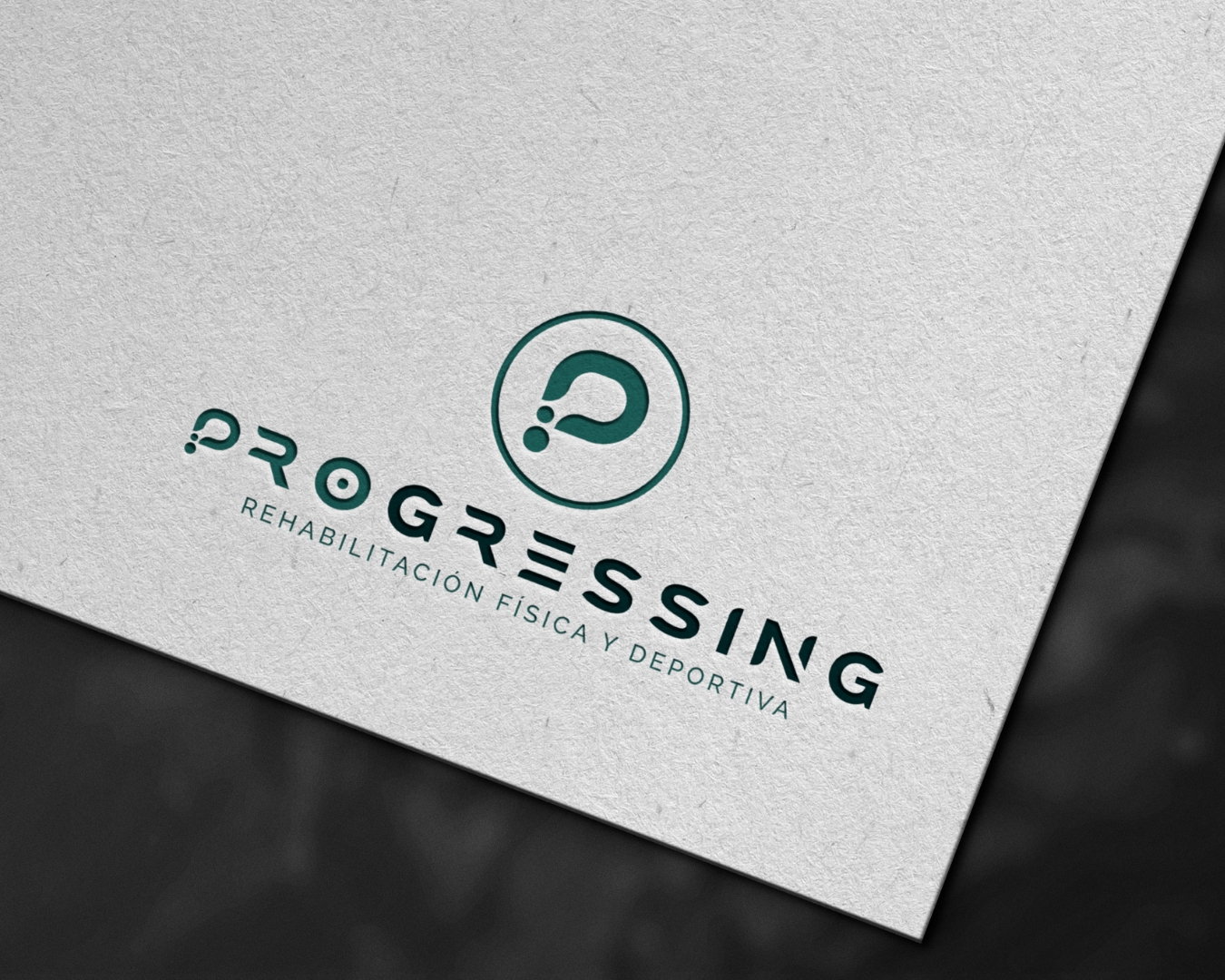 Logo Progressing aplicacion sobre papel
